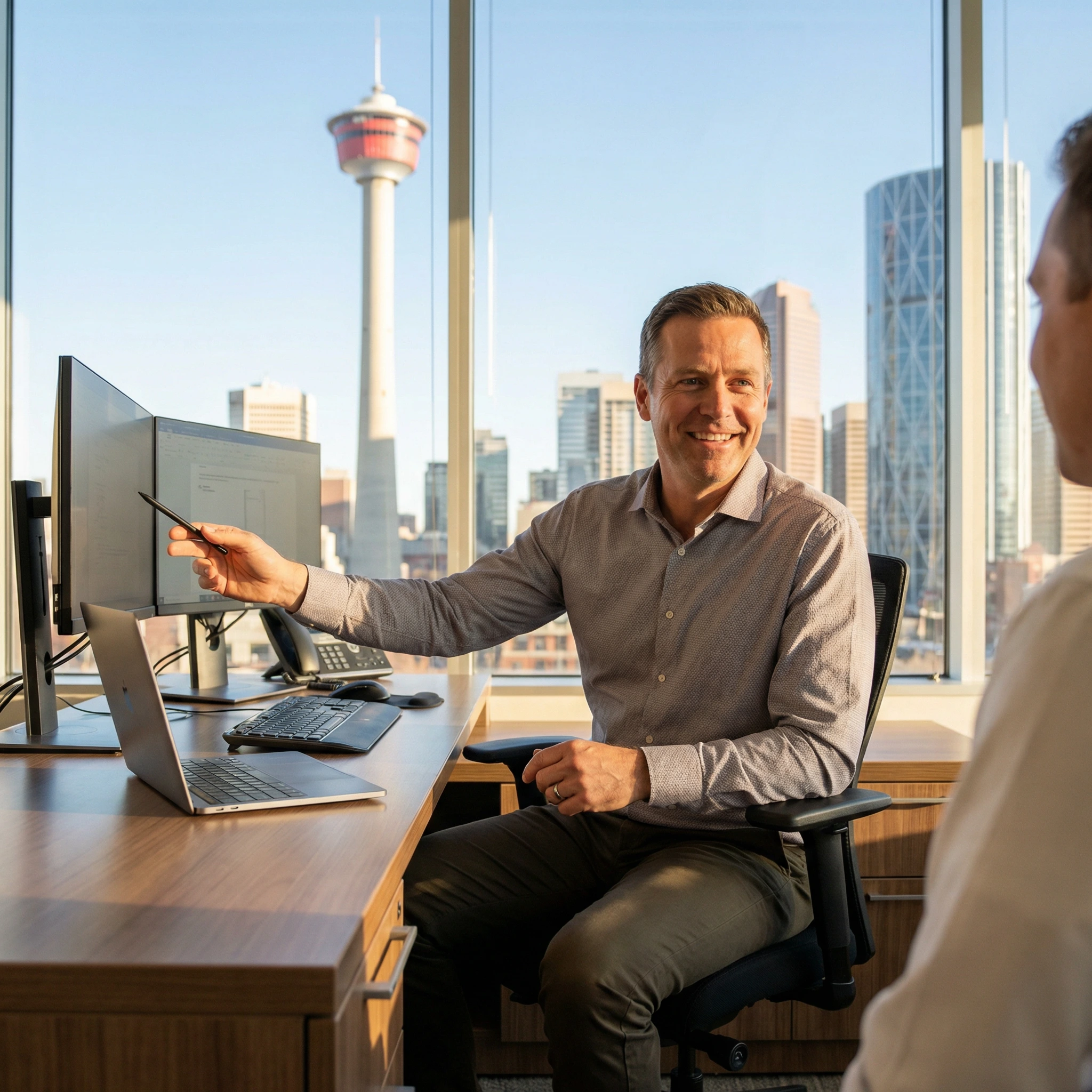 IT Professional business meeting in modern office setting in Calgary Alberta.